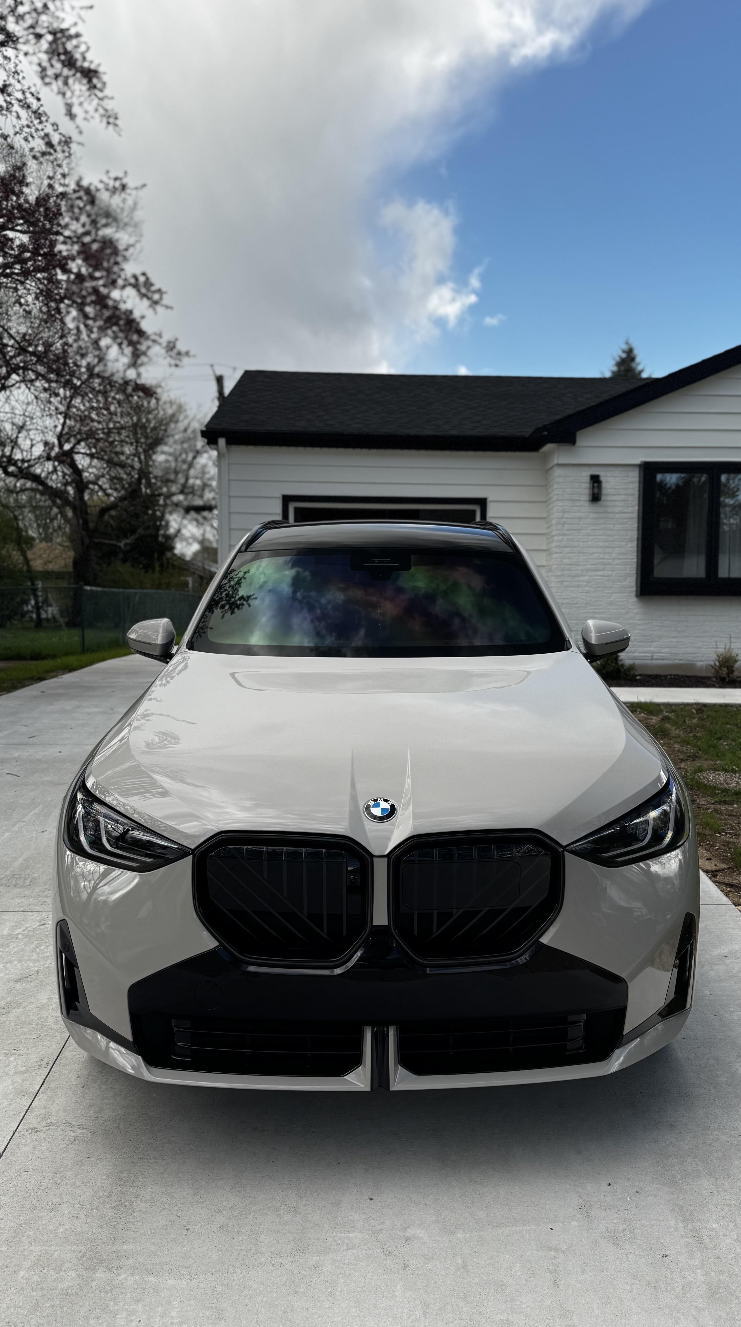 Chalk white BMW SUV after a full detail